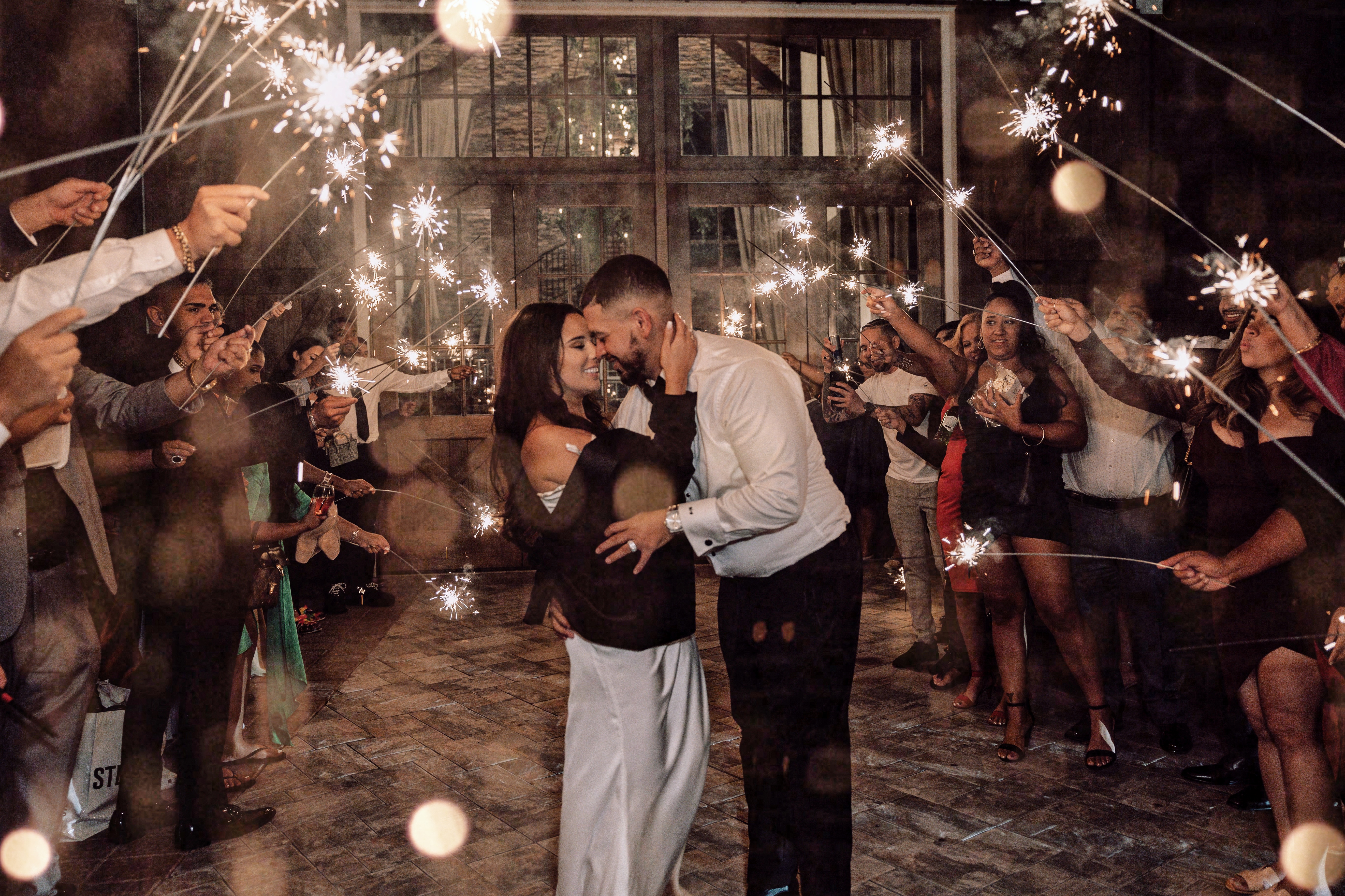 newlyweds in front of sparkler exit at the end of their wedding