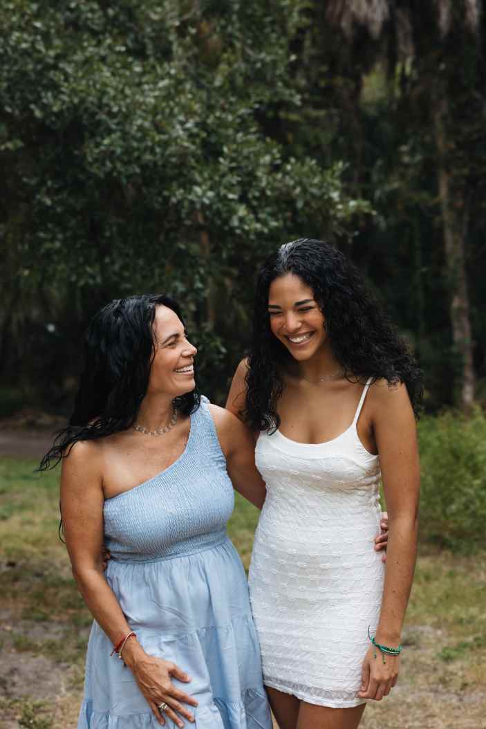 mother and teenage daughter laughing together