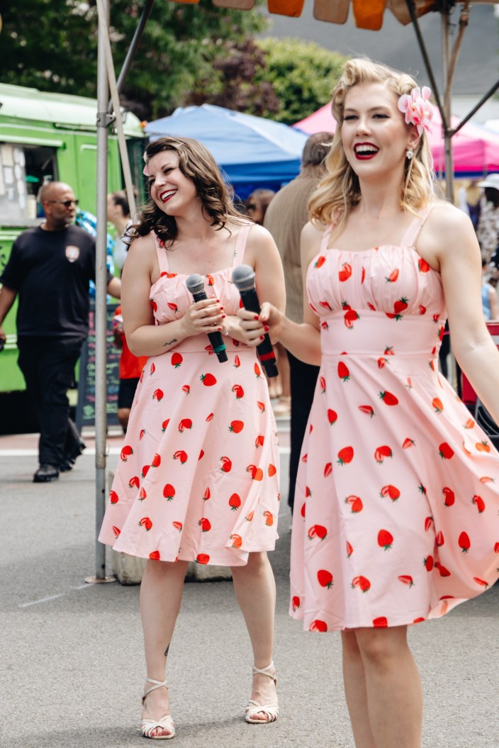 pin up singers singing in the stratford main street festival in June 2026